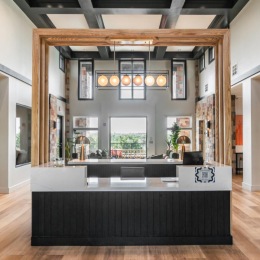 a room with a counter and wood floors