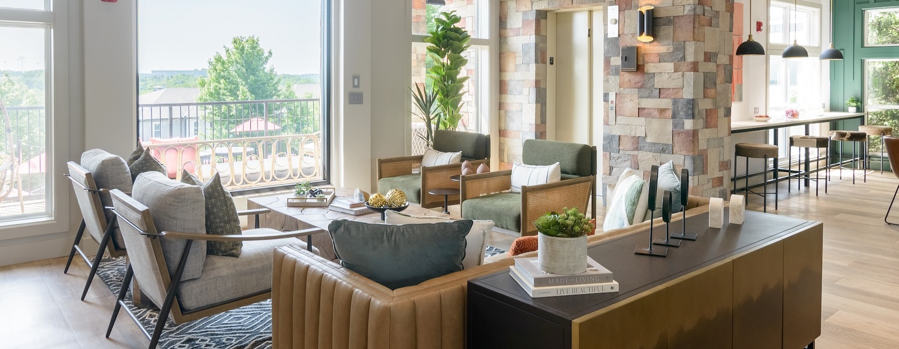 a clubroom with a couch, tables and chairs