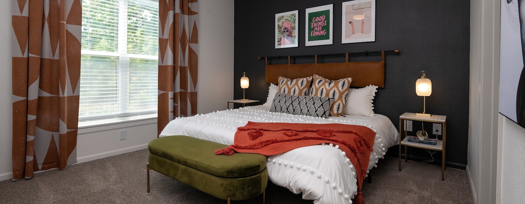 a bedroom with a bed and a bench